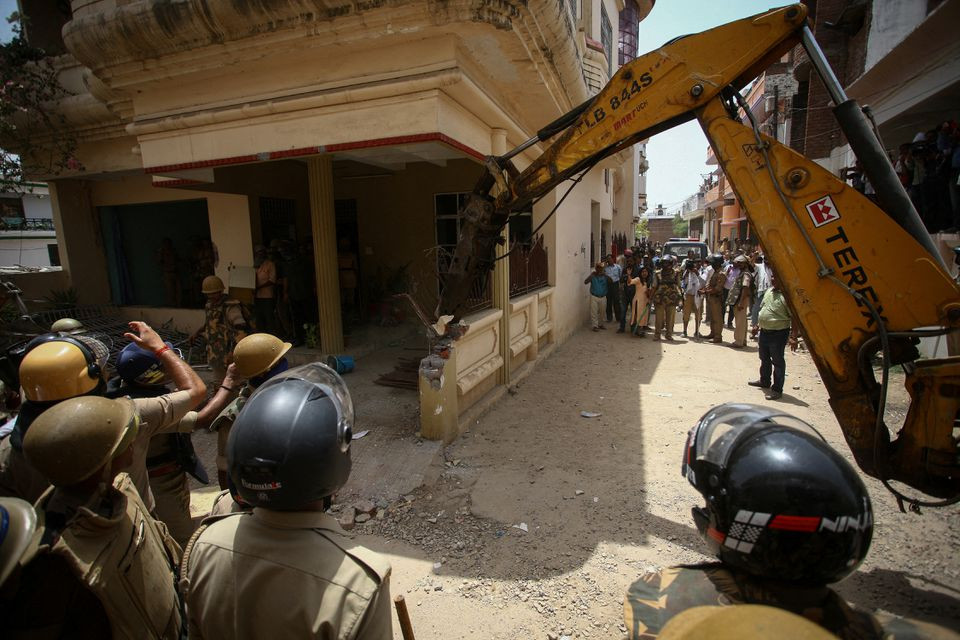 Heavy equipment is used to demolish the house of a Muslim man that Uttar Pradesh state authorities accuse of being involved in riots last week, that erupted following comments about the Prophet Mohammed by India's ruling Bharatiya Janata Party (BJP) members, in Prayagraj, India, June 12, 2022. Authorities claim the house was illegally built. Photo: Reuters