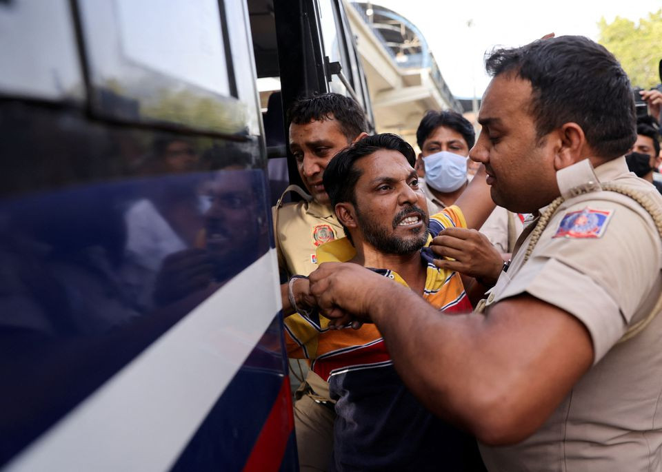 police officials detain a hindu right wing group supporter who was attending a march in support of the suspended bharatiya janata party bjp spokeswoman nupur sharma for her comments on prophet mohammed in new delhi india june 11 2022 photo reuters