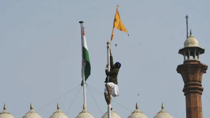 Indian farmers ride flag-bedecked tractors in protest - Vimarsana News