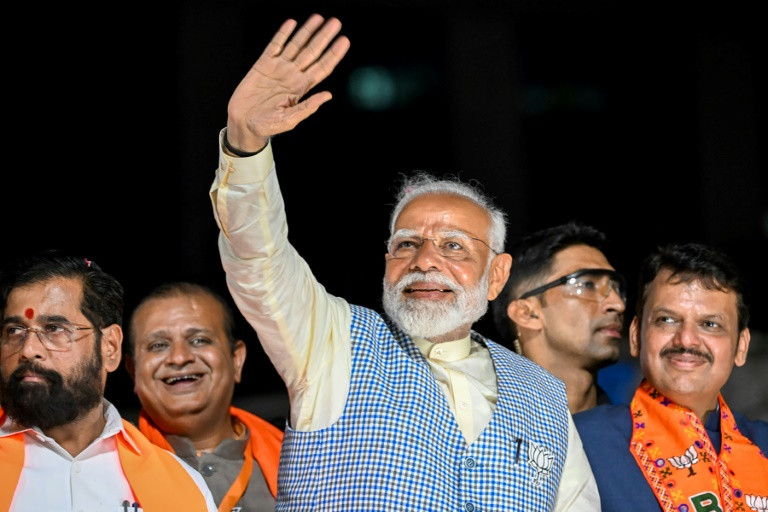 india s prime minister narendra modi waves to a crowd in mumbai on may 15 2024 photo afp