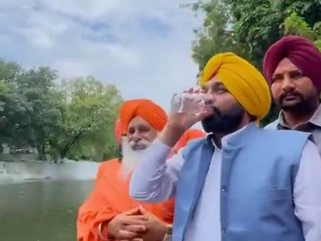 chief minister of indian punjab bhagwant mann can be seen scooping up a glass of water from a river and gulping it down screengrab chief minister of indian punjab bhagwant mann can be seen scooping up a glass of water from a river and gulping it down screengrab