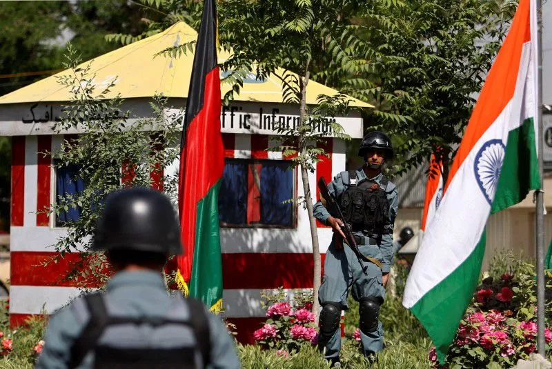 afghan policemen stand guard next to indian and afghan national flags at a check point in kabul city may 12 2011 photo reuters afghan policemen stand guard next to indian and afghan national flags at a check point in kabul city may 12 2011 photo reuters