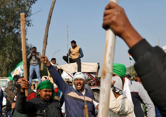 farmers shout slogans as they block the road during a protest against farm bills passed by india s parliament at delhi noida border on the outskirts of delhi india december 16 2020 photo reuters