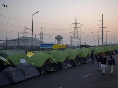 indian farmers block highway outside delhi to mark 100th day of protest