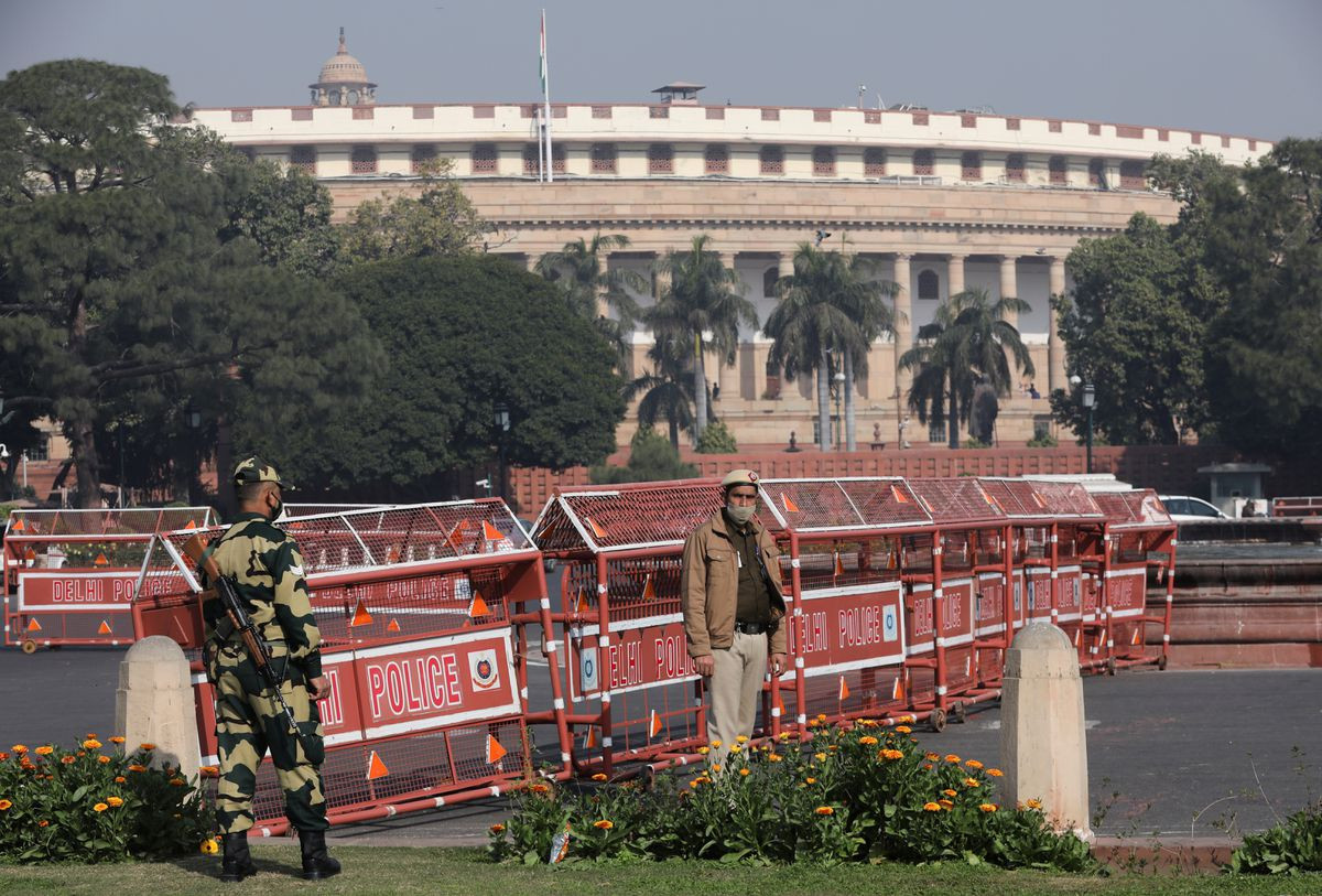 security personnel stand guard next to barricades outside the parliament where annual budget is being presented in new delhi india february 1 2021 reuters anushree fadnavis