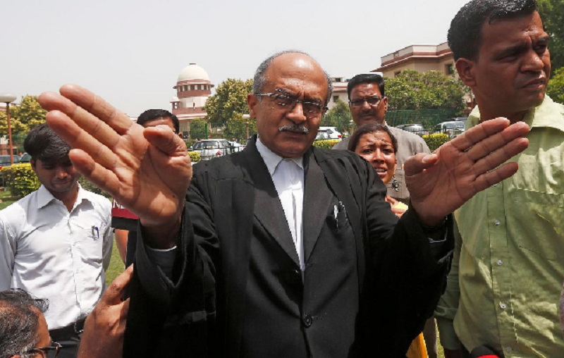 prashant bhushan a senior lawyer speaks with the media outside the supreme court in new delhi india april 19 2018 photo reuters