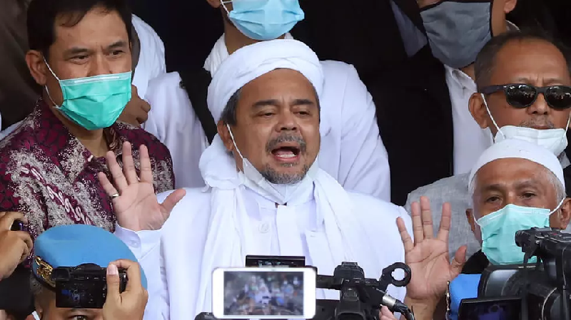 indonesia arrests firebrand cleric over virus rule breaches