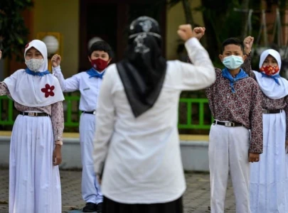 indonesian school shaves 14 girls hair over teacher s hijab complaint indonesian school shaves 14 girls hair over teacher s hijab complaint