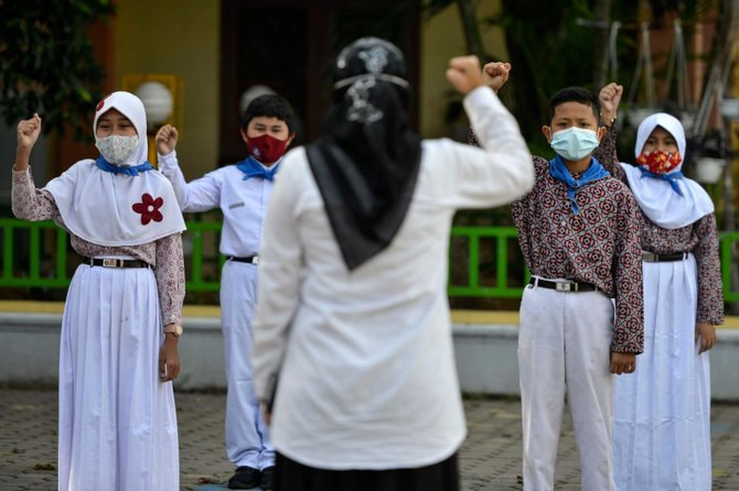 activists say muslim and non muslim girls have been forced for years to wear a hijab in conservative parts of indonesia photo afp