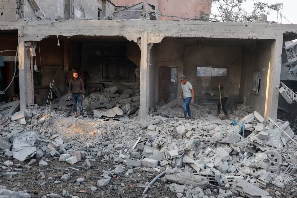 palestinians inspect the site of an israeli strike on a house in nuseirat in the central gaza strip on november 7 2024 photo reuters