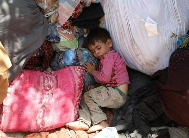 an internally displaced child from northern provinces who fled from his home due the fighting between taliban and afghan security forces sleeps in a public park that they use as shelter in kabul afghanistan august 10 2021 photo reuters an internally displaced child from northern provinces who fled from his home due the fighting between taliban and afghan security forces sleeps in a public park that they use as shelter in kabul afghanistan august 10 2021 photo reuters