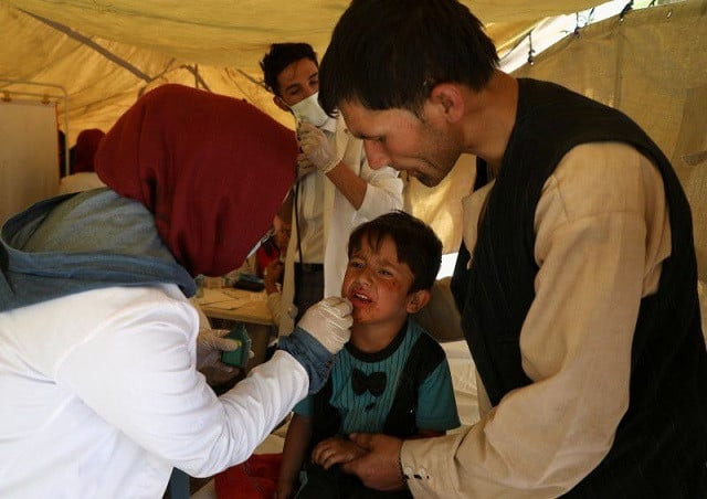 an internally displaced child from northern provinces who fled from his home due the fighting between taliban and afghan security forces receives medical treatment in a public park used as a shelter in kabul afghanistan august 10 2021 photo reuters an internally displaced child from northern provinces who fled from his home due the fighting between taliban and afghan security forces receives medical treatment in a public park used as a shelter in kabul afghanistan august 10 2021 photo reuters