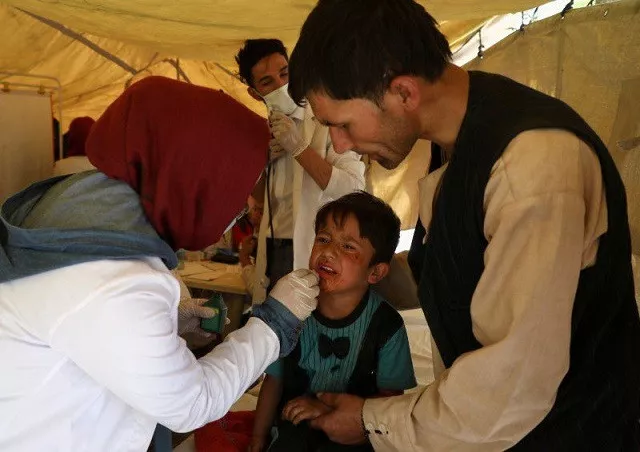 an internally displaced child from northern provinces who fled from his home due the fighting between taliban and afghan security forces receives medical treatment in a public park used as a shelter in kabul afghanistan august 10 2021 photo reuters an internally displaced child from northern provinces who fled from his home due the fighting between taliban and afghan security forces receives medical treatment in a public park used as a shelter in kabul afghanistan august 10 2021 photo reuters