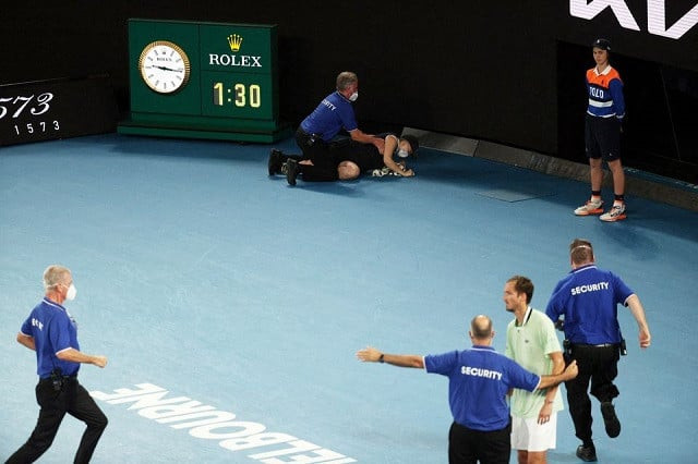 a protestor is detained by security after jumping on to the court during the final in melbourne australia on jan 30 2022 photo reuters a protestor is detained by security after jumping on to the court during the final in melbourne australia on jan 30 2022 photo reuters