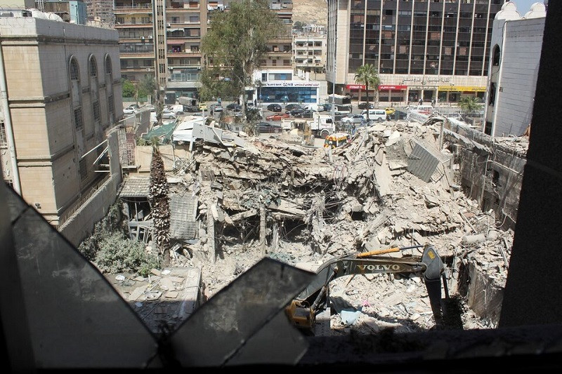 an excavator clears rubble after a suspected israeli strike on monday on iran s consulate in damascus syria april 2 2024 photo reuters