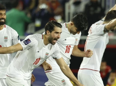 iran survive penalty drama to book asian cup clash with japan