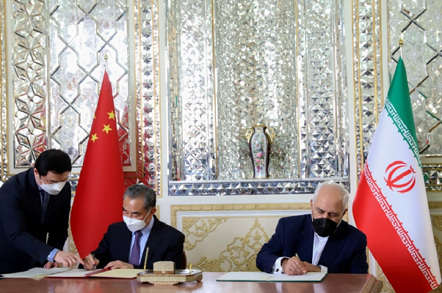 iran s then foreign minister mohammad javad zarif and chinese counterpart wang yi sign a 25 year cooperation agreement in tehran last year photo reuters