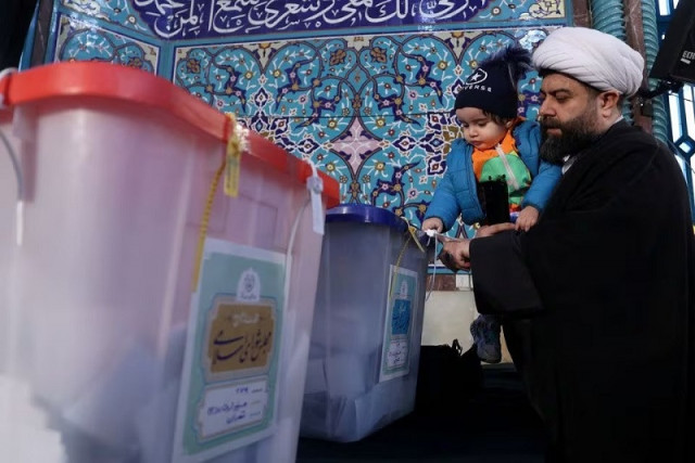 an iranian cleric casts his vote during parliamentary elections at a polling station in tehran iran march 1 2024 photo reuters an iranian cleric casts his vote during parliamentary elections at a polling station in tehran iran march 1 2024 photo reuters