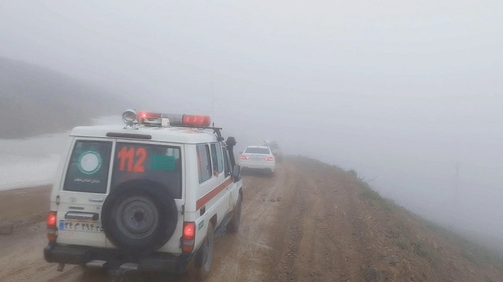 An ambulance and other vehicles drive on a foggy road following a crash of a helicopter carrying Iran's President Ebrahim Raisi, in Varzaqan , East Azerbaijan Province, Iran. PHOTO: Reuters