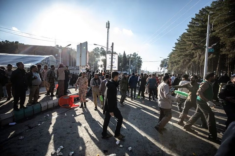 People gather at the scene of explosions during a ceremony held to mark the death of late Iranian General Qassem Soleimani, in Kerman, Iran, January 3, 2024. PHOTO: REUTERS