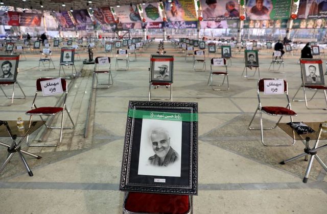 a photo of qassem soleimani is seen during a ceremony to mark the one year anniversary of the killing of senior iranian military commander general qassem soleimani in a us attack in tehran iran january 1 2021 photo reuters