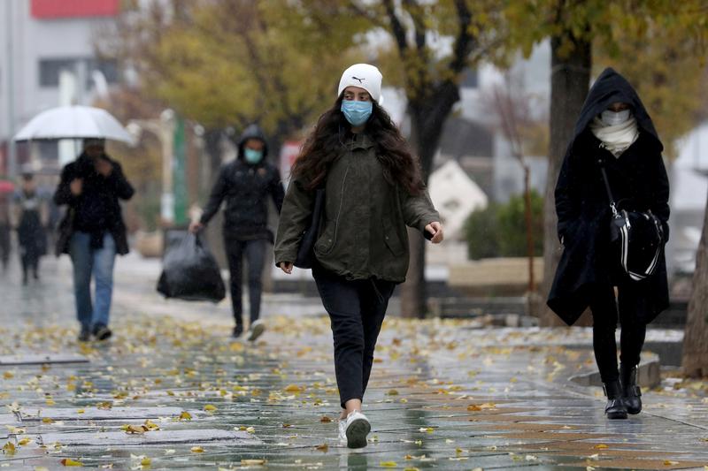 people walk on a street after tehran reopened following a two week shutdown amid the coronavirus disease covid 19 iran december 6 2020 photo reuters file