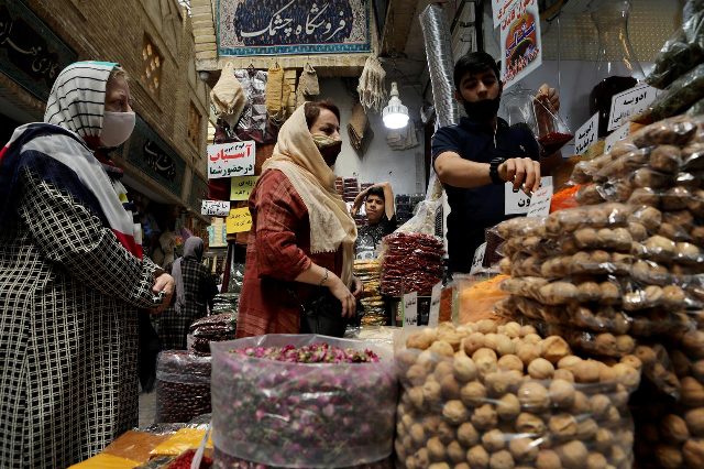 women wearing protective face masks shop at a bazaar following the outbreak of the covid 19 photo reuters file women wearing protective face masks shop at a bazaar following the outbreak of the covid 19 photo reuters file