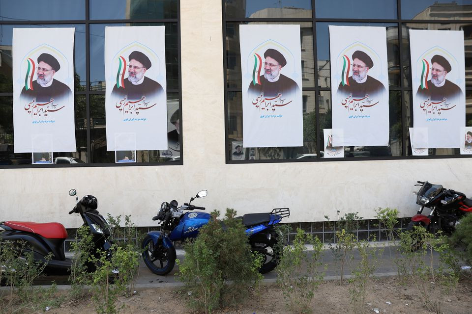 posters of presidential candidate ebrahim raisi are seen at a campaign center in tehran iran june 4 2021 photo reuters