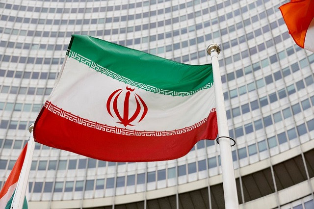 the iranian flag waves in front of the international atomic energy agency iaea headquarters in vienna austria may 23 2021 photo reuters