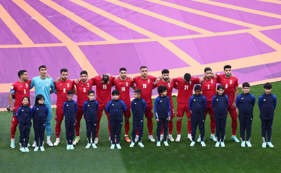 iran players line up during the national anthems before the match photo reuters