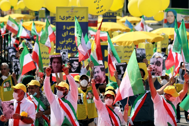 supporters of the national council of resistance of iran ncri gather to protest against the government in tehran and the use of the death penalty in iran in front of the brandenburg gate in berlin germany july 10 2021 photo reuters supporters of the national council of resistance of iran ncri gather to protest against the government in tehran and the use of the death penalty in iran in front of the brandenburg gate in berlin germany july 10 2021 photo reuters