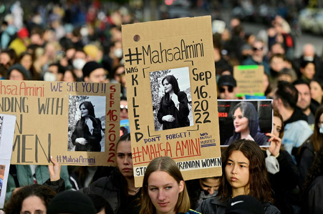 demonstrators in berlin hold up placards with images of mahsa amini in berlin photo afp demonstrators in berlin hold up placards with images of mahsa amini in berlin photo afp