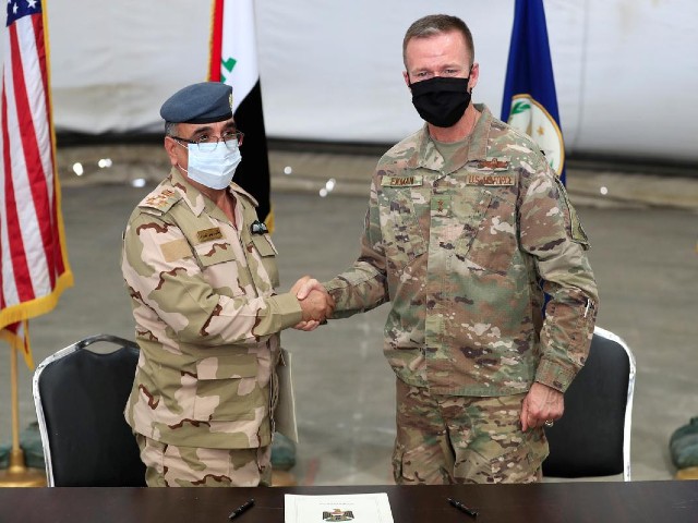 maj gen kenneth p ekman deputy commander of combined joint task force operation inherent resolve shakes hand with brigadier general salah abdullah during a handover ceremony of taji military base from us led coalition troops to iraqi security forces in the base north of baghdad iraq august 23 2020 photo reuters