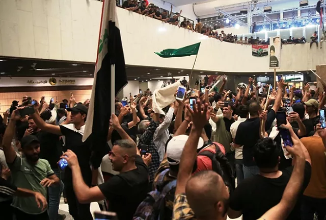 supporters of shia cleric moqtada al sadr storm the iraqi parliament building in baghdad s fortified green zone for the second time in a week on july 30 2022 photo anadolu agency supporters of shia cleric moqtada al sadr storm the iraqi parliament building in baghdad s fortified green zone for the second time in a week on july 30 2022 photo anadolu agency