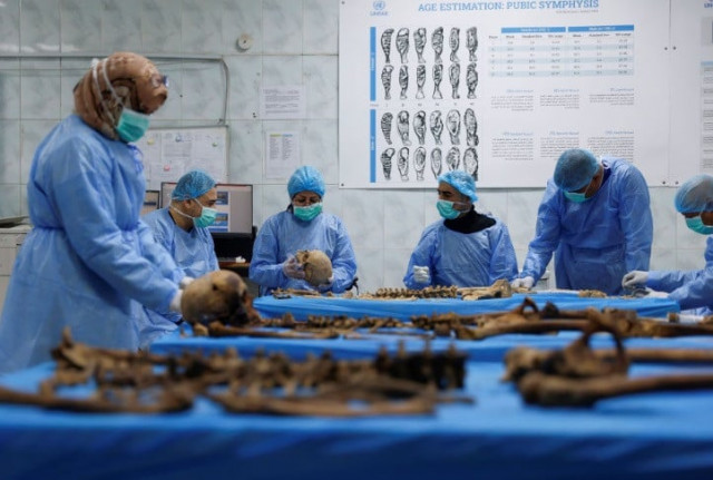file photo a team works to identify remains exhumed from a mass grave in the mass grave section of the medico legal directorate of iraq s ministry of health in baghdad iraq january 30 2023 reuters ahmed saad file photo a team works to identify remains exhumed from a mass grave in the mass grave section of the medico legal directorate of iraq s ministry of health in baghdad iraq january 30 2023 reuters ahmed saad