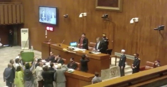 pml n leader ishaq dar takes oath of as pti senators protest   photo screengrab
