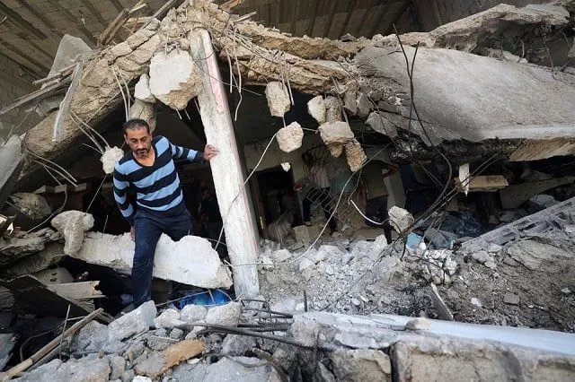 a palestinian man walks through the ruins in the aftermath of israeli air strikes in gaza city may 17 2021 photo reuters a palestinian man walks through the ruins in the aftermath of israeli air strikes in gaza city may 17 2021 photo reuters