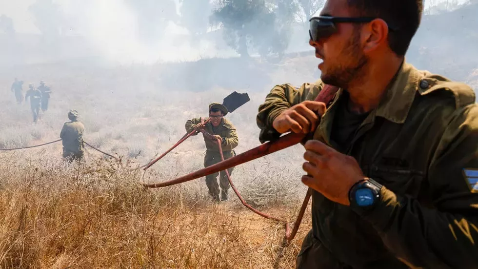 fire bombs fitted to balloons launched across the border from gaza have sparked extensive blazes on farmland in southern israel photo afp fire bombs fitted to balloons launched across the border from gaza have sparked extensive blazes on farmland in southern israel photo afp