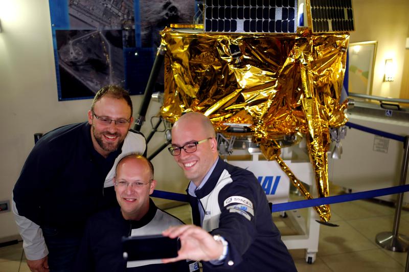 file photo members of israeli non profit group spaceil and representatives from israel aerospace industries iai do a selfie in front of a model of beresheet spacecraft near the control room in yahud israel april 11 2019 reuters amir cohen file photo file photo