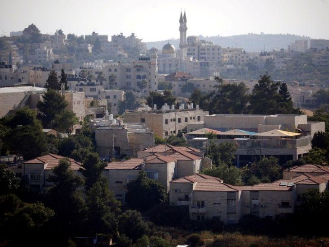 a general view shows part of the jewish settlement of beit el in the foreground near ramallah in the israeli occupied west bank july 1 2020 photo reuters file