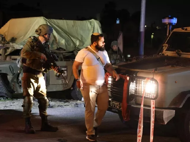 israeli soldiers stand round a damaged military vehicle at the site of a car ramming attack near the town of beit ummar in the occupied west bank photo afp israeli soldiers stand round a damaged military vehicle at the site of a car ramming attack near the town of beit ummar in the occupied west bank photo afp