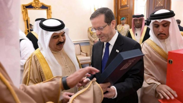 bahrain s king hamad bin isa al khalifa receives a gift from israeli president isaac herzog photo afp bahrain s king hamad bin isa al khalifa receives a gift from israeli president isaac herzog photo afp