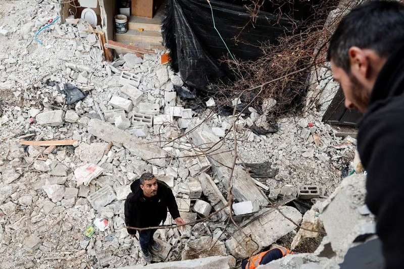 A man stands on rubble after an Israeli raid, at Nour Shams refugee camp in Tulkarm, in the Israeli-occupied West Bank, January 18, 2024. PHOTO: REUTERS