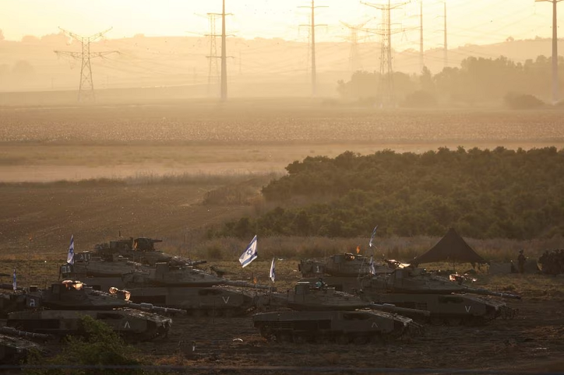 a formation of israeli tanks is positioned near israel s border with the gaza strip photo reuters