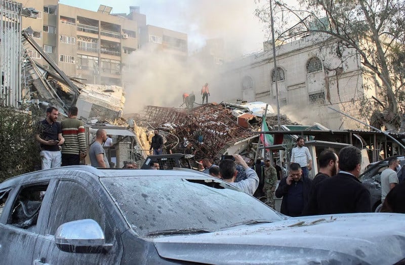 people gather near the damaged site after an israeli air strike on iran s consulate in the syrian capital damascus april 1 2024 photo reuters