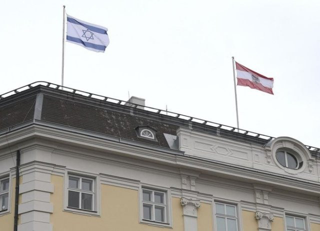 the austrian federal chancellery raised the israeli flag left as a sign of solidarity in vienna on may 14 2021 photo afp