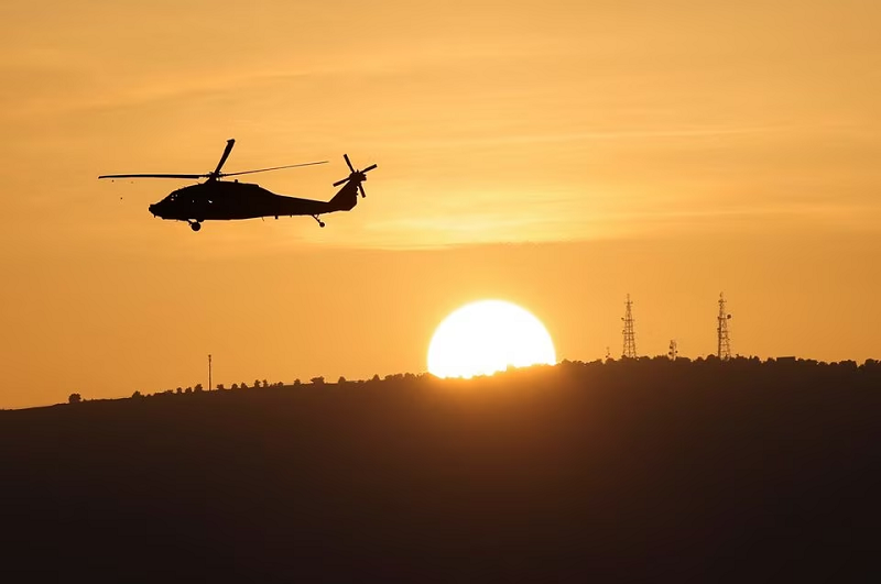 an israeli military helicopter flies over northern israel near the border with lebanon november 2 2023 photo reuters