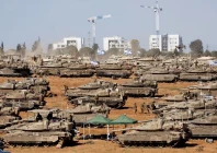 israeli soldiers stand next to military vehicles near the israel gaza border in southern israel may 7 2024 photo reuters