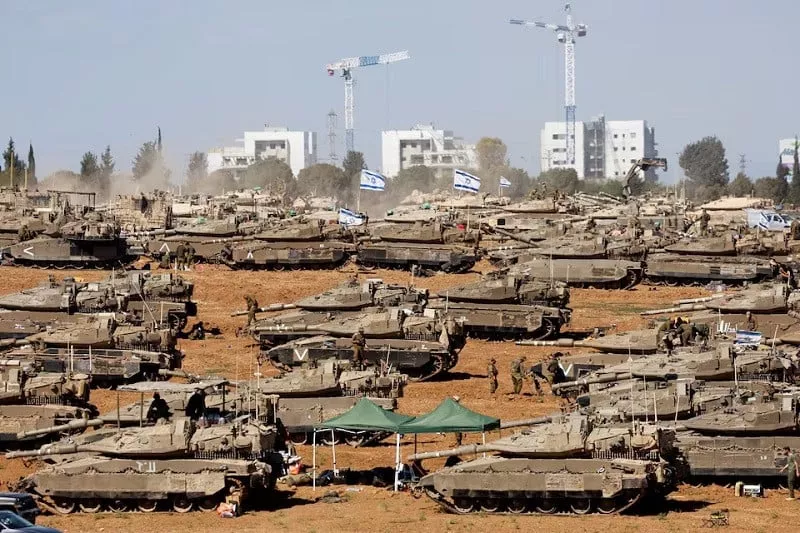 israeli soldiers stand next to military vehicles near the israel gaza border in southern israel may 7 2024 photo reuters israeli soldiers stand next to military vehicles near the israel gaza border in southern israel may 7 2024 photo reuters