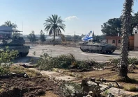 israeli military vehicles operate on the gazan side of the rafah crossing in this image released on may 7 photo reuters